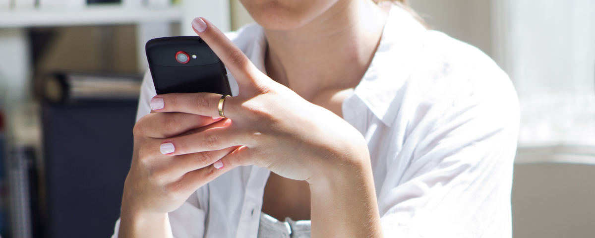 Woman on phone with text to pay